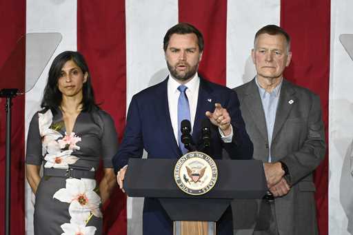 Vice President JD Vance, center, speaks at a rally about "America's industrial resurgence," as he i…