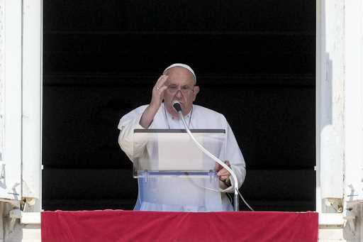 Pope Francis delivers his blessing as he recites the Angelus noon prayer from the window of his stu…