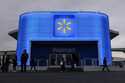 People walk by the Walmart booth during the CES tech show on January 9, 2024, in Las Vegas