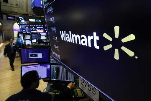 In this February 18, 2020 file photo, the logo for Walmart appears above a trading post on the floo…
