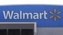 A Walmart logo is displayed outside of a Walmart store, in Walpole, Mass