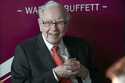 Warren Buffett, chairman and CEO of Berkshire Hathaway, smiles as he plays bridge following the ann…