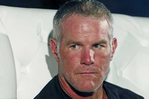 Retired NFL quarterback Brett Favre participates in a question and answer session at a fundraiser f…