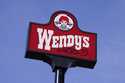 A sign for Wendy's restaurant stands over one of its locations, February 25, 2021, in Des Moines, I…