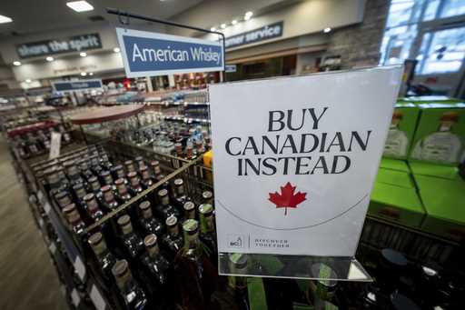 A sign is placed in front of the American whiskey section at a B