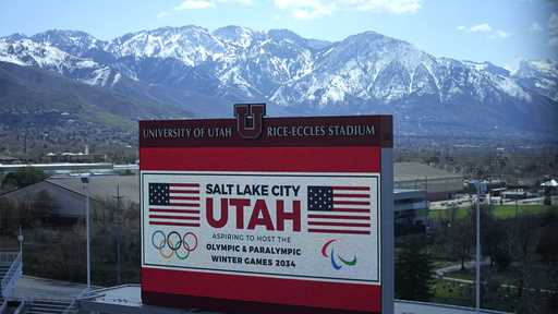 The scoreboard at the University of Utah's Rice-Eccles Stadium promotes Salt Lake City's bid to hos…