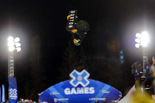 Ayumu Hirano, of Japan, flies through the air during his first run in the men's snowboard superpipe…