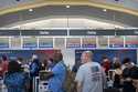 Travelers stand in line at a Delta Air Lines counter at Reagan National Airport on Friday, July 19,…