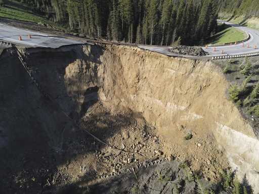This photo provided by Wyoming Highway Patrol shows a damaged section of Teton Pass near Jackson, W…