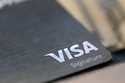 FILE- This photo shows a Visa logo on a credit card in New Orleans, August 11, 2019