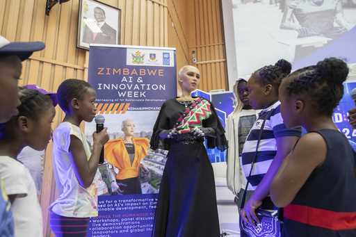 Sophia, the humanoid robot, responds to questions from children at the University of Zimbabwe, Hara…