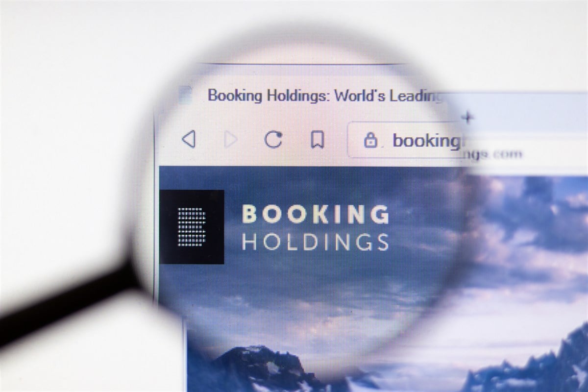 magnifying glass on Booking Holdings website as Booking Holdings announces earnings beat