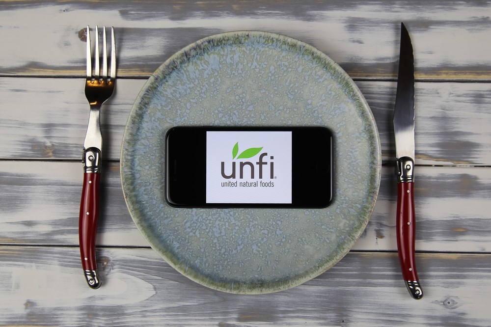 United Natural Foods stock logo on plate