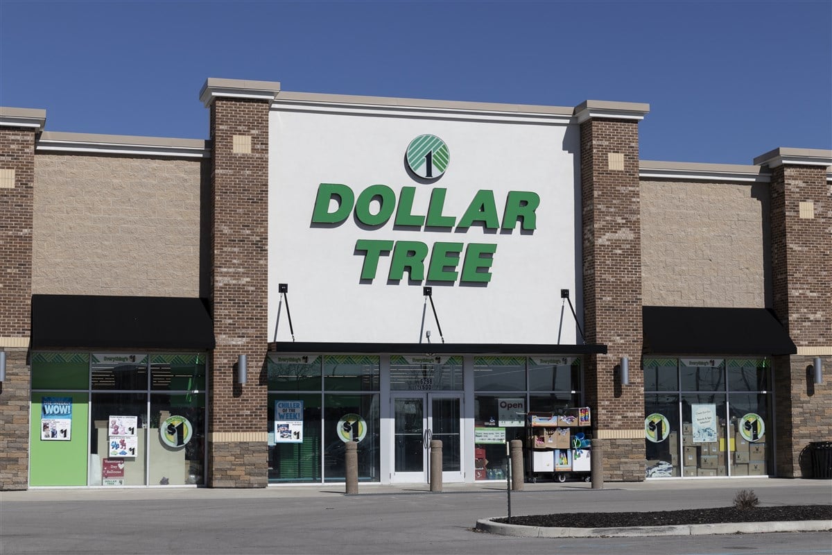 Image of dollar tree logo mounted on storefront on white background