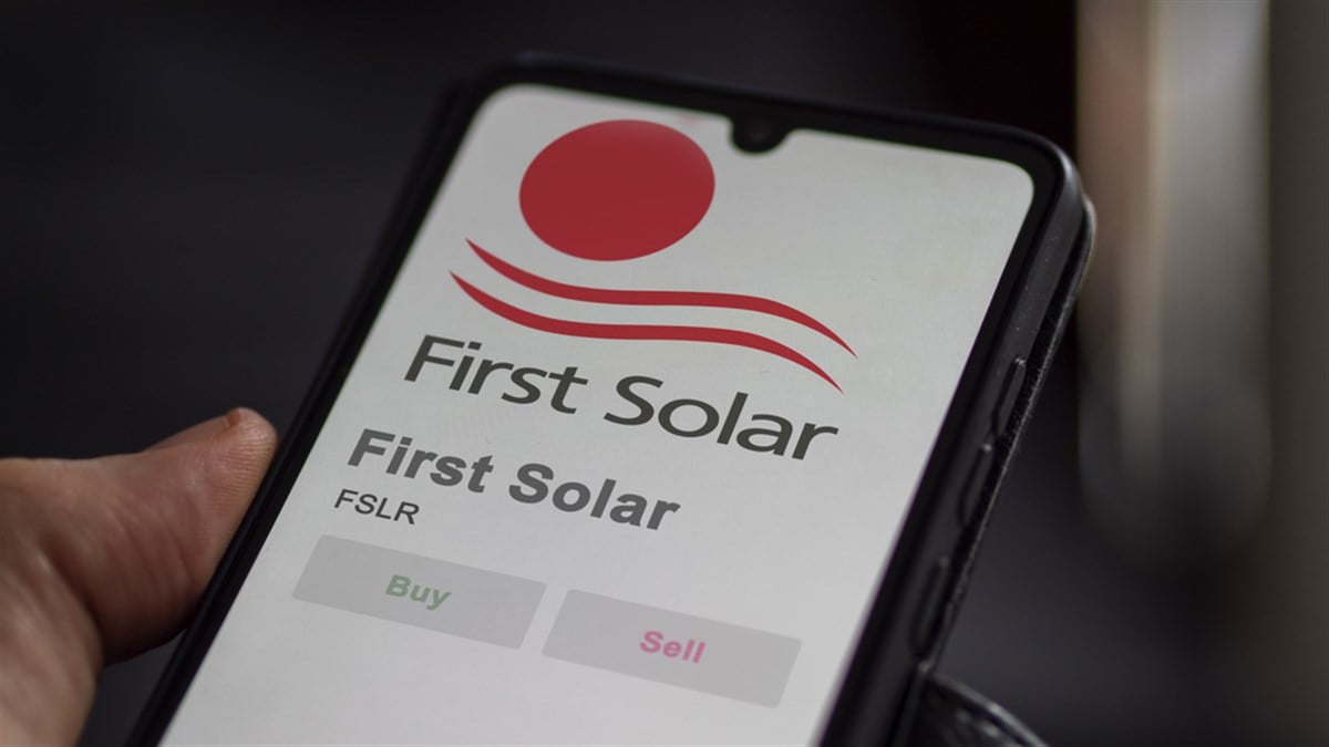 first solar logo and stock market on smartphone screen