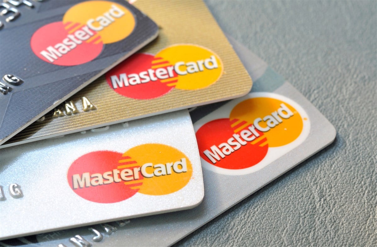Mastercard credit cards on leather board.
