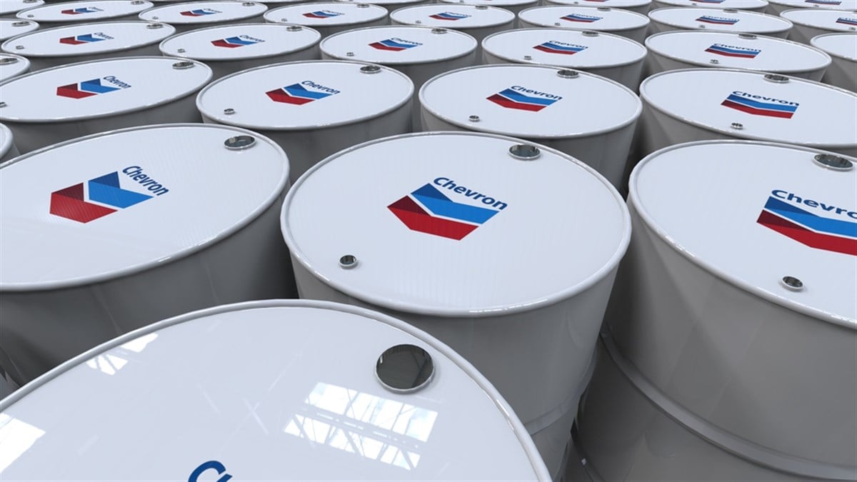 Chevron Editorial photo of crude oil barrels featuring branding from a corporate petrochemical company