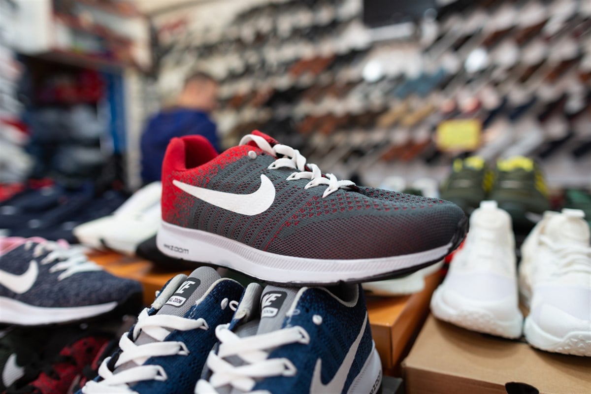 ANTALYA / TURKEY - January 19, 2020: Shoes of various brands stands in a shoe market shop