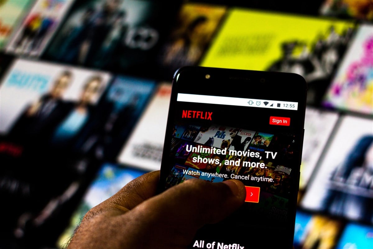 In this photo illustration the Netflix logo is displayed on a smartphone - Stock Editorial Photography