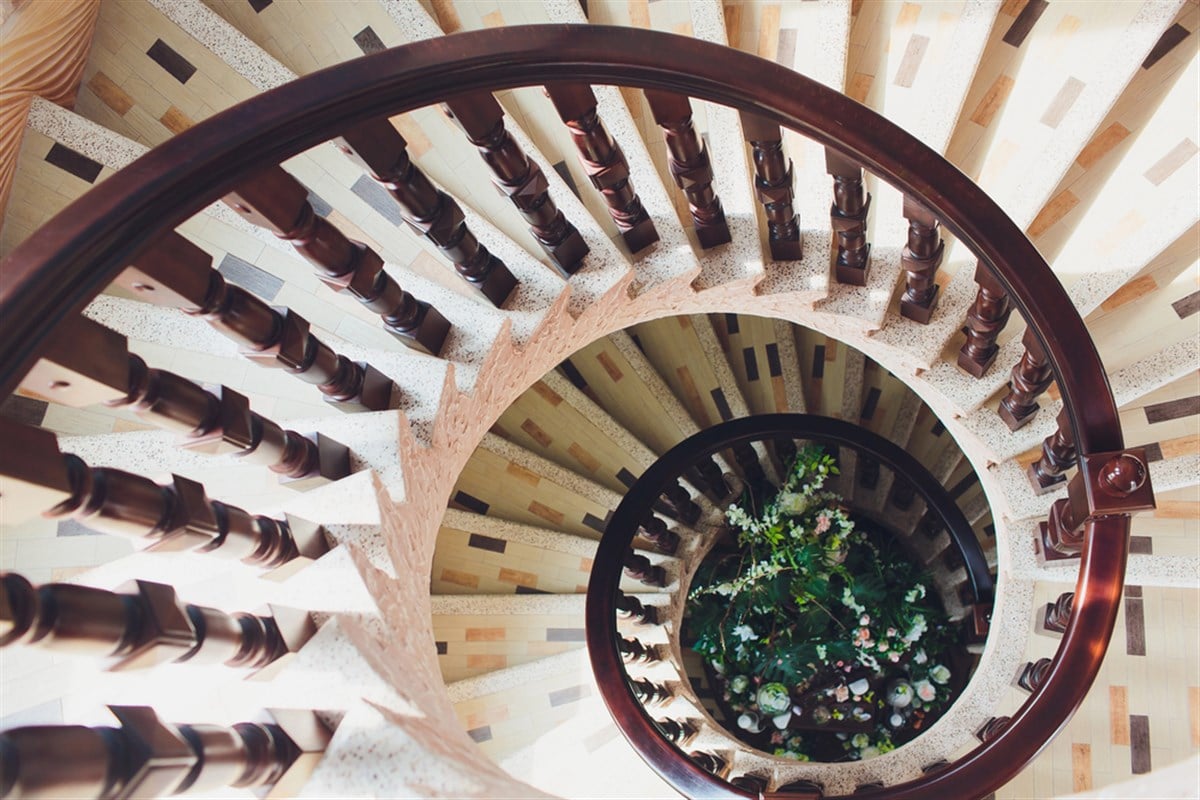 Yellow light in the center of spiral staircase Fibonacci spiral