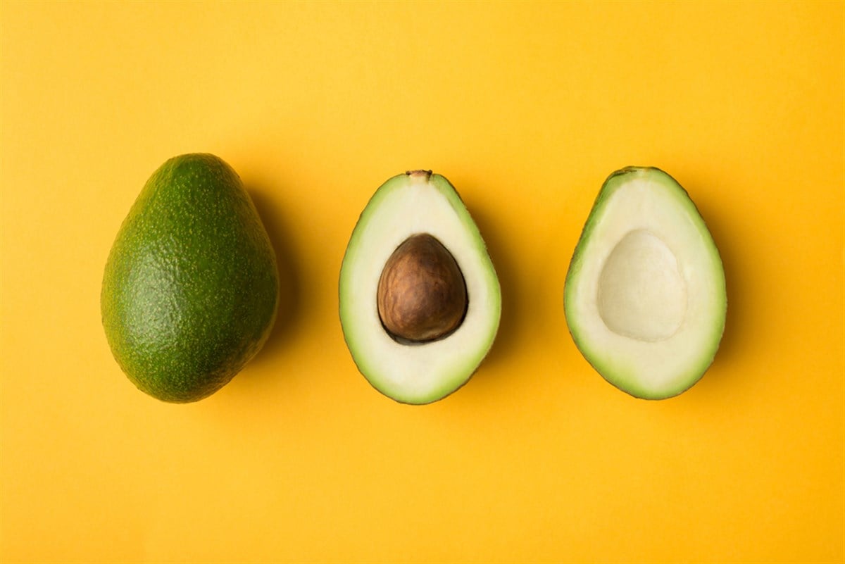 Top above overhead view close-up photo of avocado row isolated on yellow background