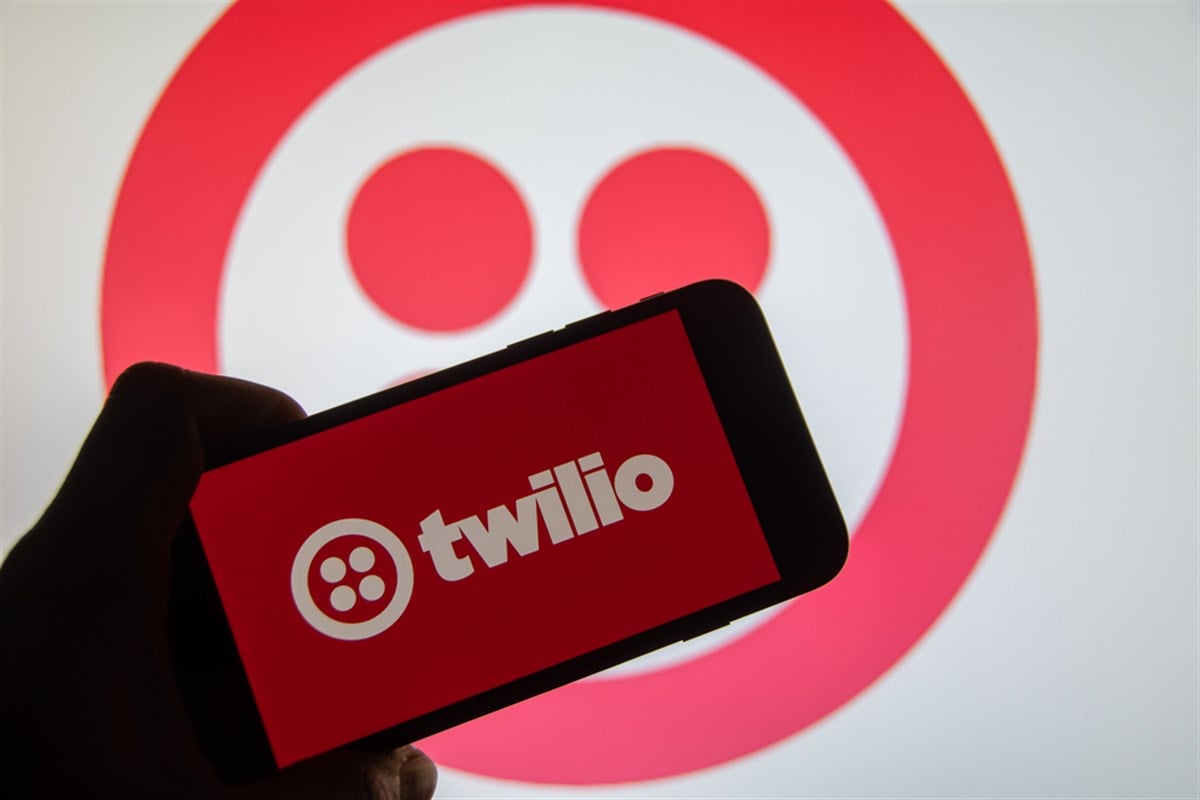 Rheinbach, Germany 21 November 2022, The brand logo of the US company "Twilio" on the display of a smartphone (focus on the brand logo) - Stock Editorial Photography