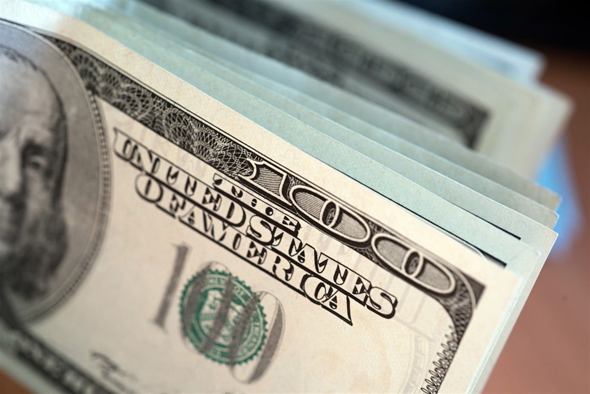 Stack of one hundred dollar bills close-up