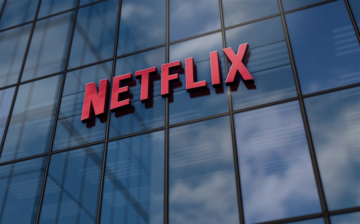 Netflix Incorporation headquarters glass building concept. Netflix TV and VOD streaming platform company symbol logo on front facade 3d illustration.