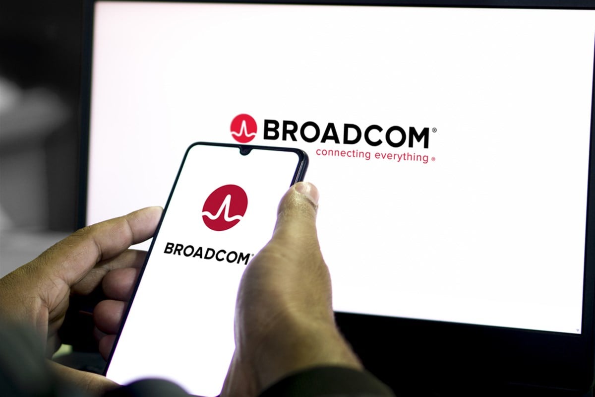 Mobile phone with logo of American semiconductor company Broadcom Inc. on screen