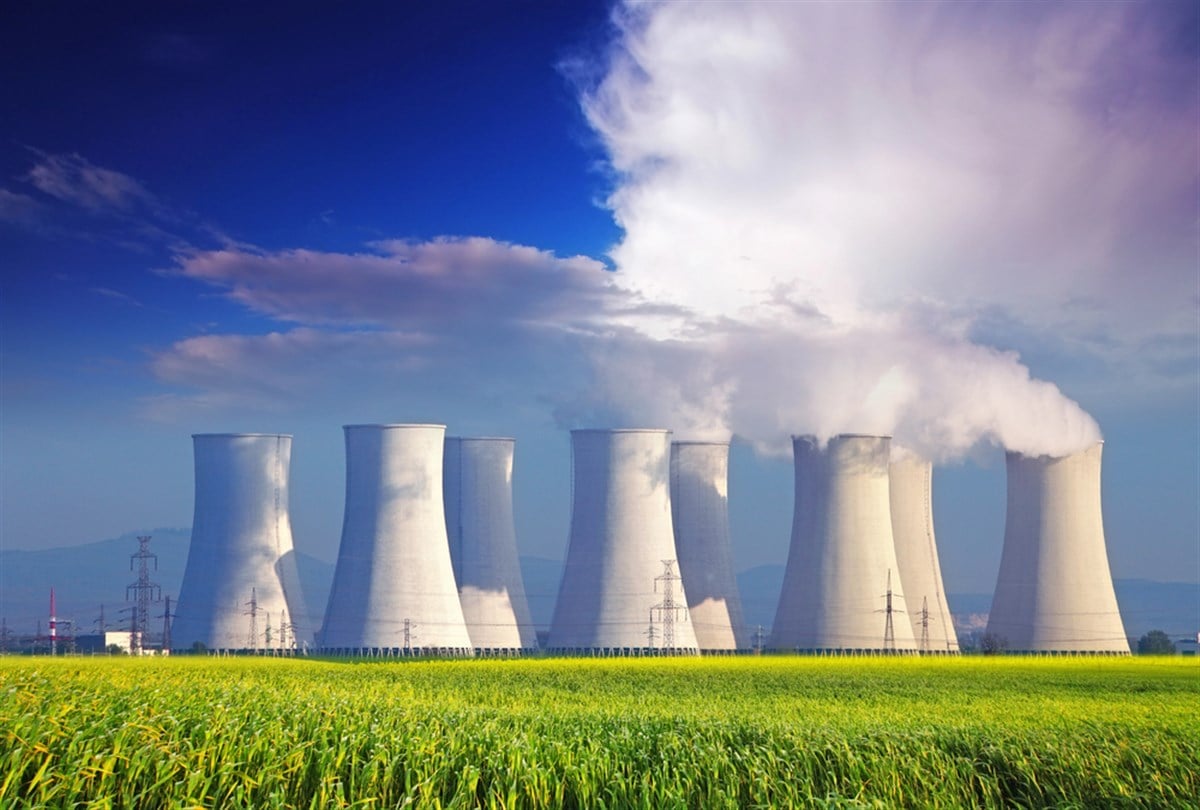 Nuclear power plant with yellow field — Photo