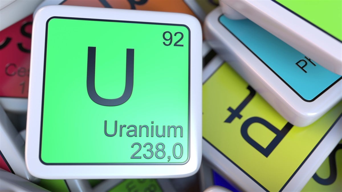 Uranium tag on the pile of periodic table of the chemical elements tags