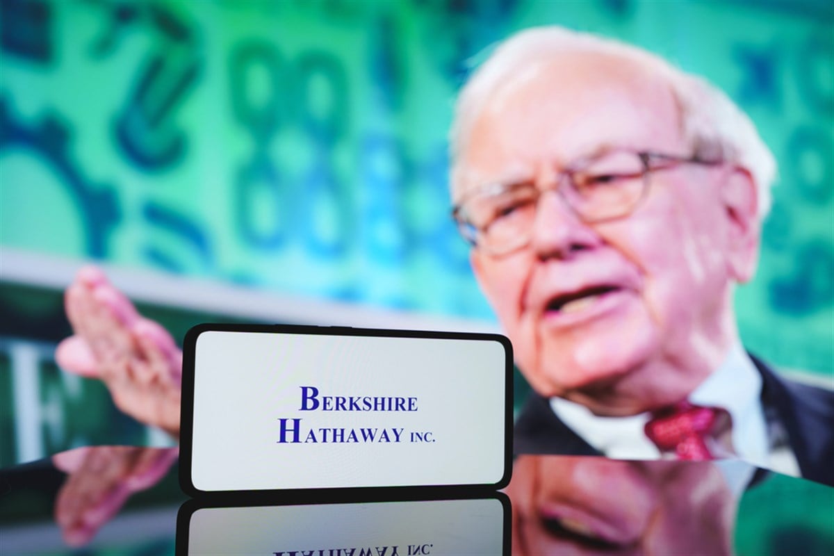 Berkshire Hathaway company and Warren Buffett in background. December 5, 2024 — Stock Editorial Photography