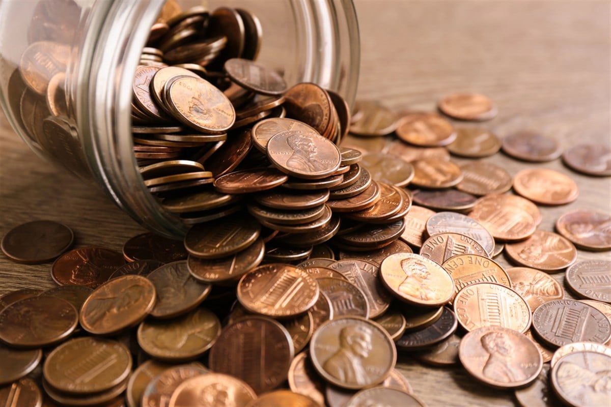 Glass jar with coins on table, closeup. Money saving concept — Photo