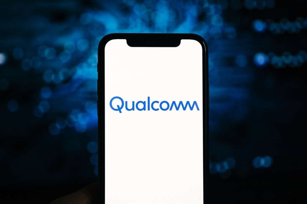 Qualcomm logo on the iPhone screen. Qualcomm is a company that manufactures processors for mobile devices. — Photo by nikkimeel