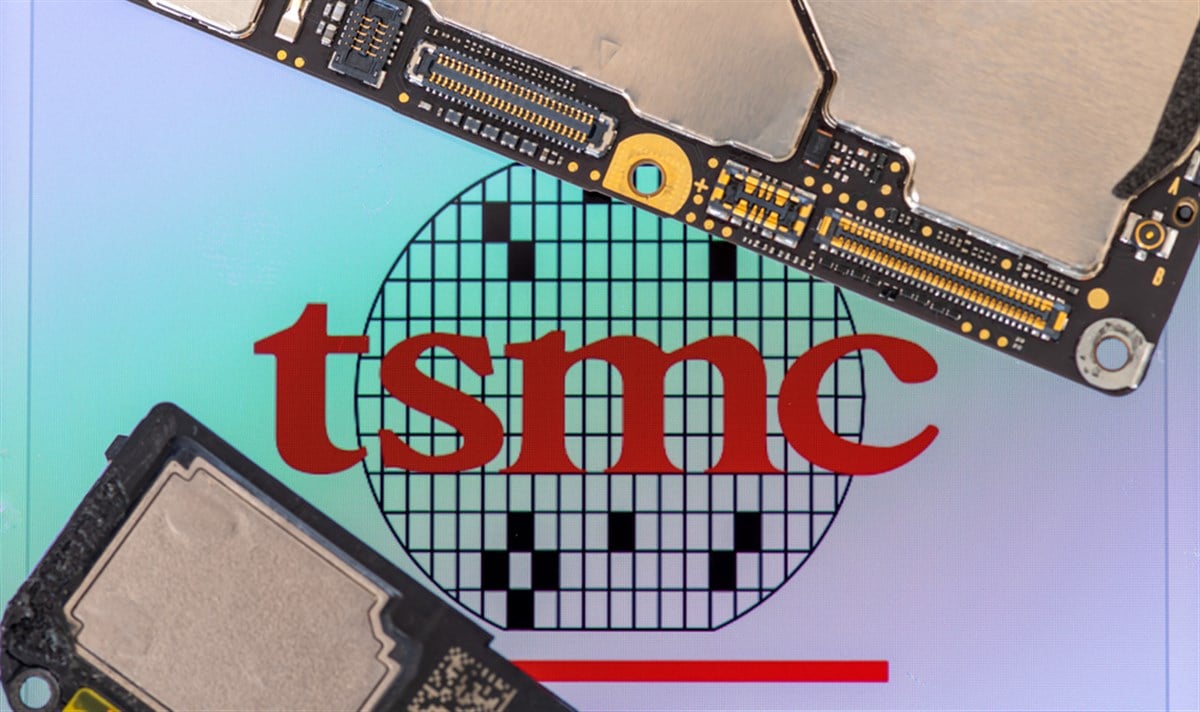 London. UK- 02.02.2025. Macro close up of the name sign for the Taiwanese semiconductors manufacturer TSMC with chips and parts from a smartphone.