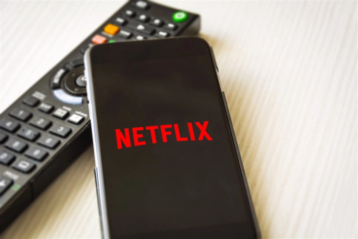 Mobile phone with the Netflix logo screen - Stock Editorial Photography