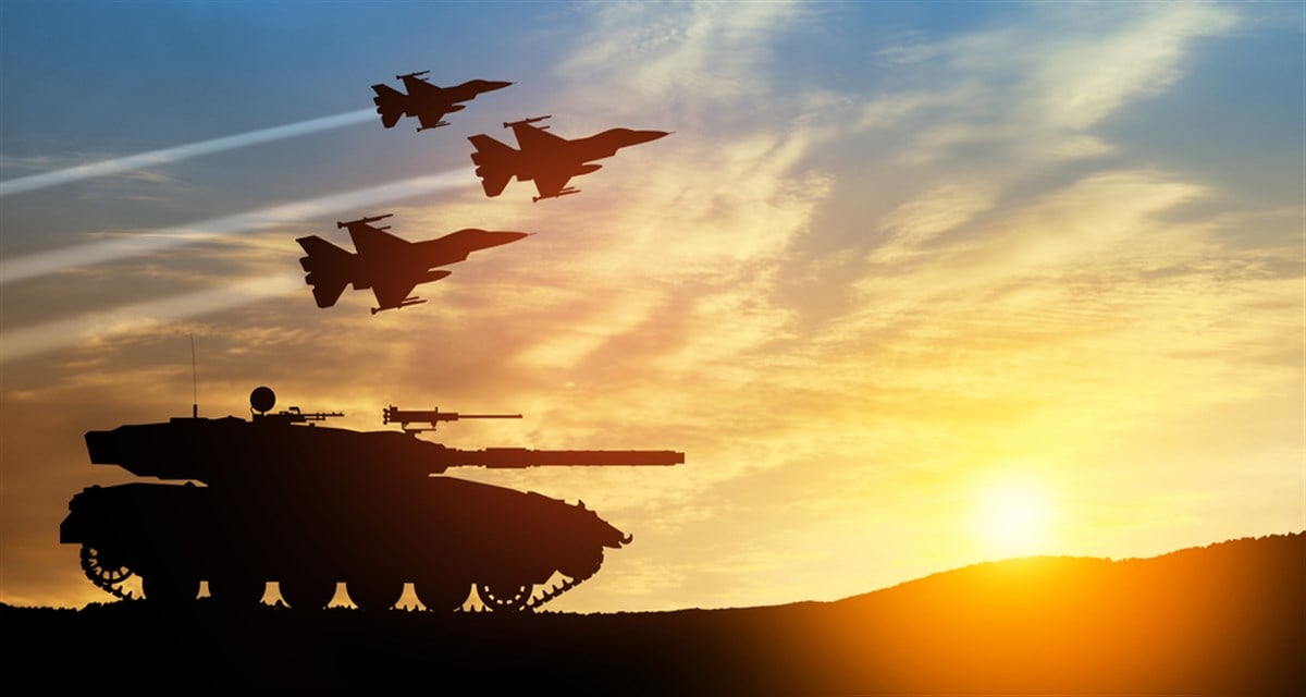 Silhouettes of army tank and fight planes on background of sunset. Military machinery. Independence day. - stock image