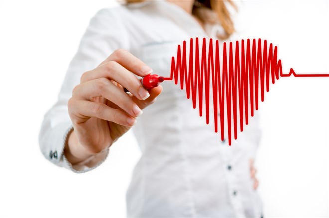 Woman drawing heart to represent healthcare stock for Accolade Inc stock