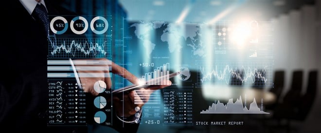 Investor analyzing stock market report and financial dashboard with business intelligence (BI), with key performance indicators (KPI).businessman hand working with finances program on wide screen computer.