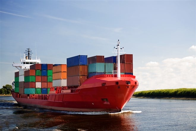 cargo container ship - freighter navigating river