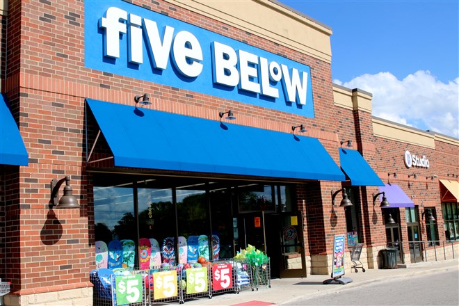 Photo of Five Below storefront under a clear blue sky