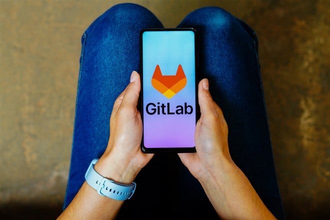 GitLab logo is displayed on a smartphone screen