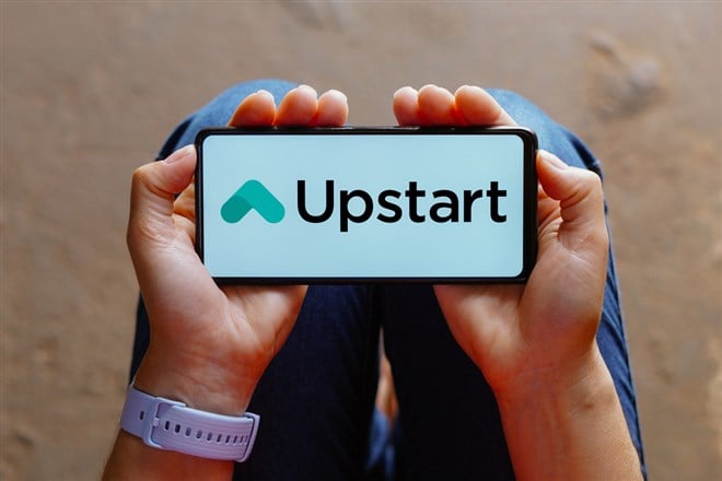 Upstart logo is displayed on a smartphone screen