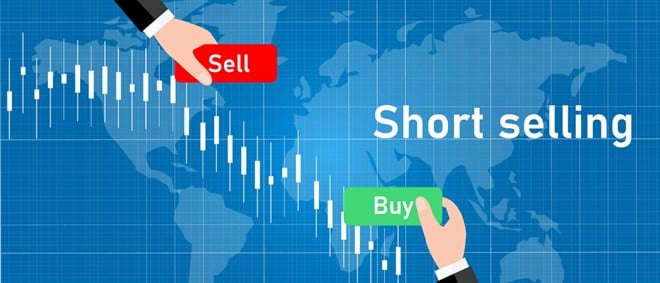 Photo of a candle stick graph chart showing Short Selling Buy Sell. How to Short Nasdaq