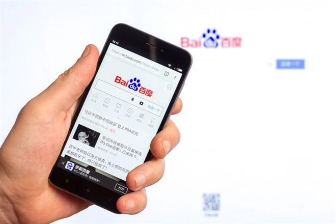 Baidu search engine on smartphone screen and computer