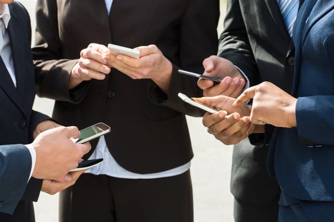 Businesspeople Hands With Mobile Phones