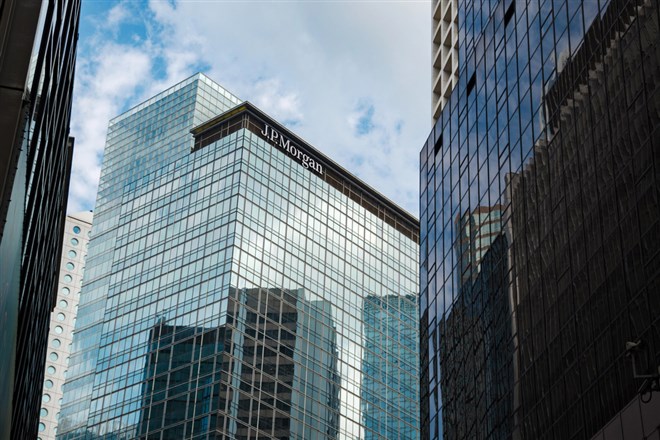 Skyscraper building of JP Morgan in Hong Kong surrounded by other skyscrapers