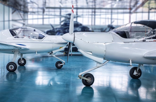 two airplanes in hangar