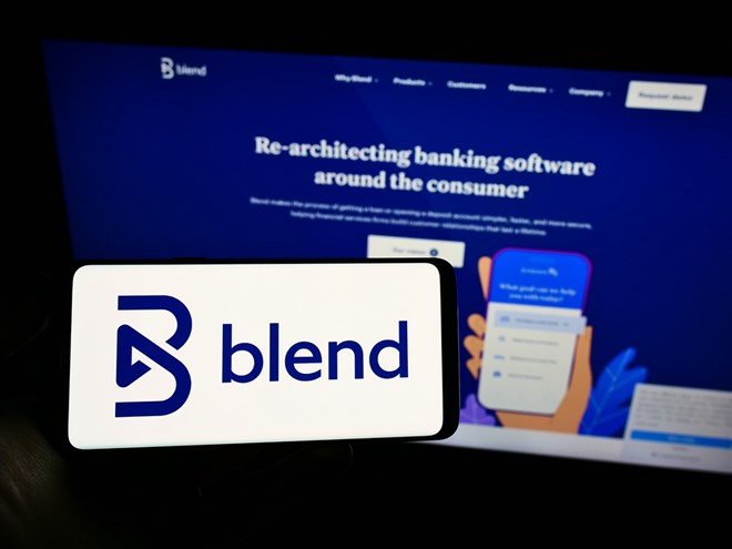 mobile phone with logo of American lending platform company Blend Labs Inc. on screen in front of web page