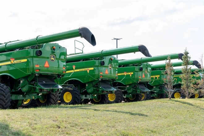 Many new John Deere agriculture and farming equipment displayed at a Brandt facility